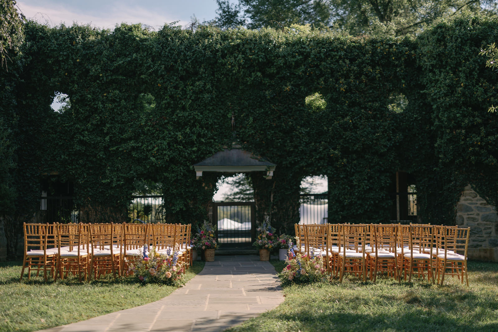 ivy covered stone wall ceremony location Goodstone Inn