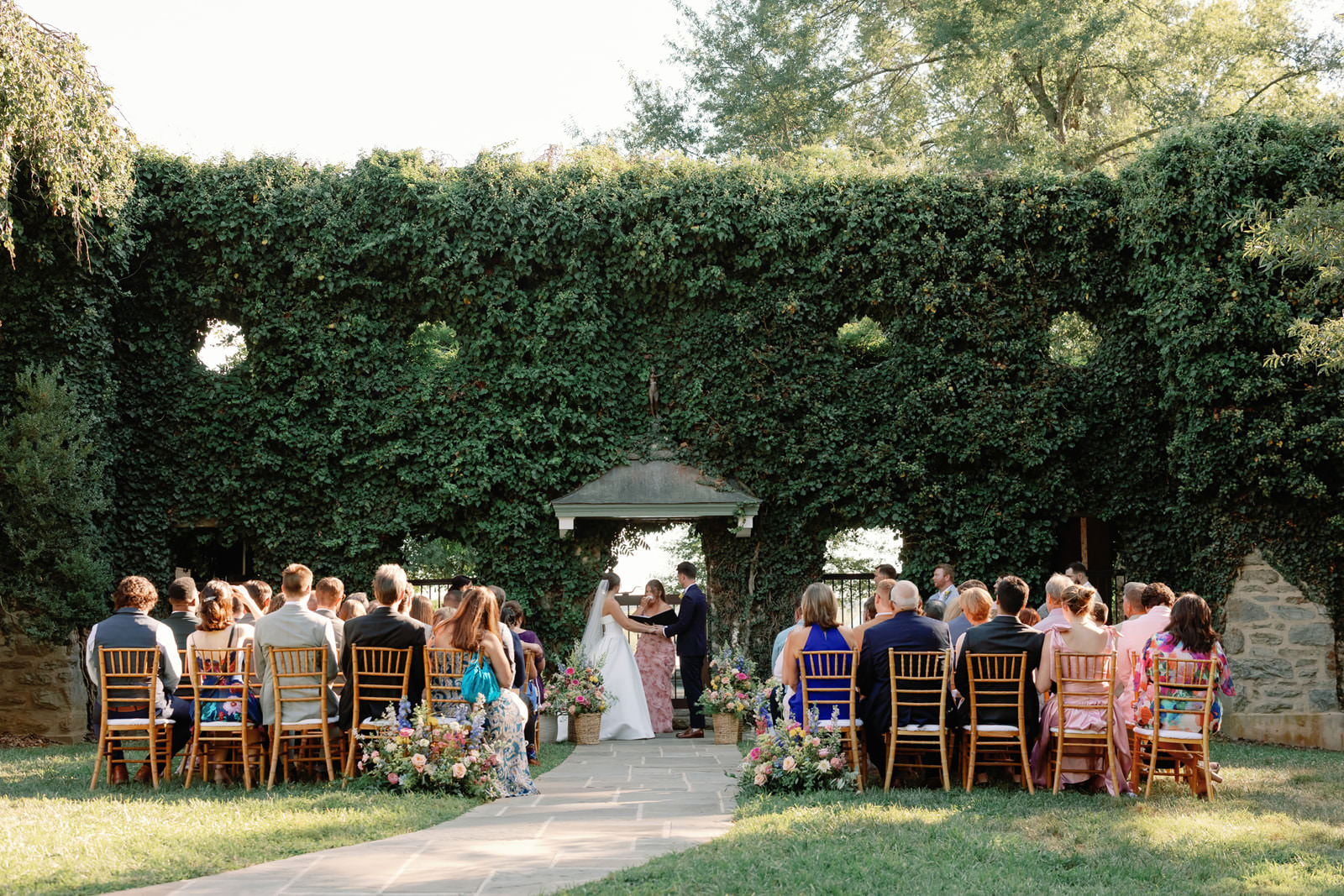 ivy covered stone wall ceremony location Goodstone Inn