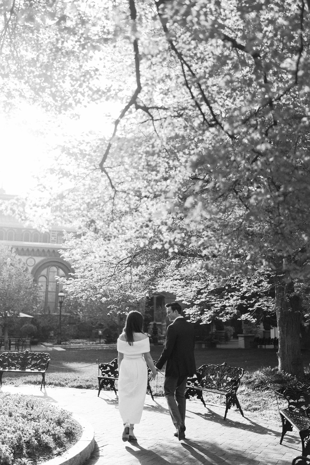 Black and white photo of a couple beneath a large tree branch at the Smithsonian gardens